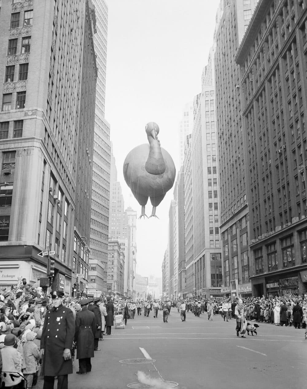 A giant turkey float squeezes between buildings as the 31st annual Macy's Thanksgiving Day Parade in 1957. (John Lindsay/AP)