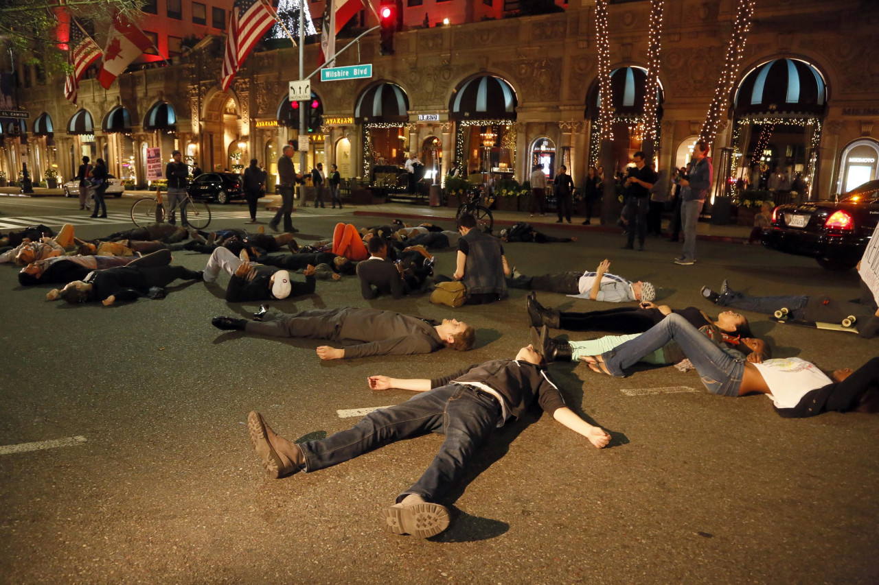 Protesters lay down on a street in Beverly Hills, Los Angeles, Calif. (Nick Ut/AP)