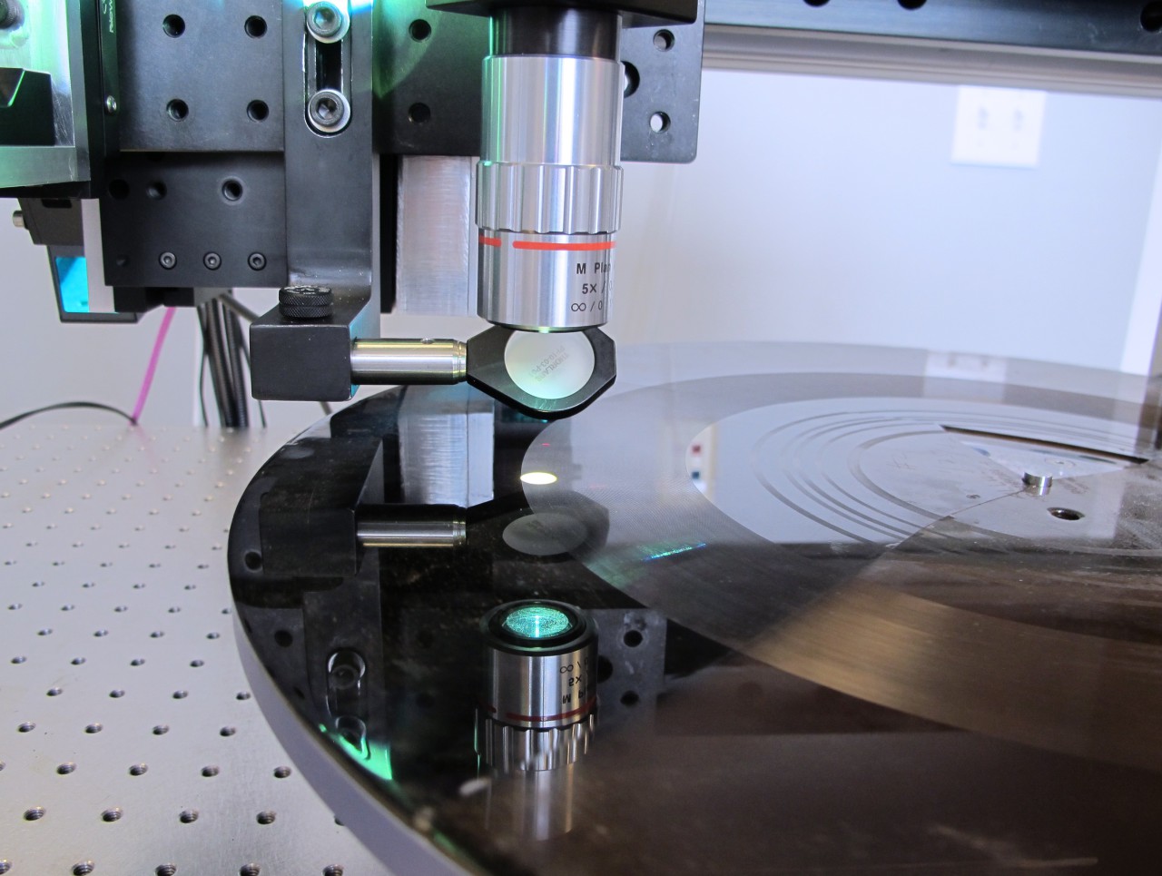 IRENE's high resolution 3D camera surveys the microscopic surface of a broken record. (Julie Martin/NEDCC)