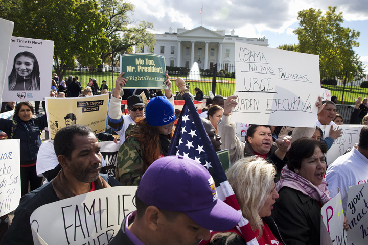 People rally for comprehensive immigration reform, Friday, Nov. 7, 2014, outside of the White House in Washington. After the midterm elections immigration groups are pushing for executive action. (AP)