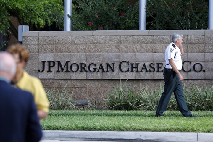 In this file photo, Hillsborough Sheriff deputy patrols outside the gate of JP Morgan Chase annual stockholders meeting held Tuesday, May 15, 2012, in Tampa, Fla. JP Morgan is one of several large financial institutions currently under investigation for alleged violation of Federal bankruptcy laws. (AP)