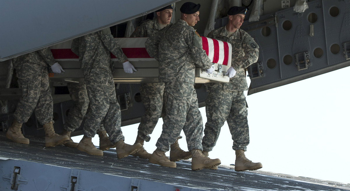 An Army carry team transfers the remains of Army Maj. Gen. Harold Greene, Thursday, Aug. 7, 2014, at Dover Air Force Base, Del., home to the nation's largest military mortuary. Greene is the highest-ranked U.S. officer to be killed in combat since 1970 during the Vietnam War. (Evan Vucci/AP)