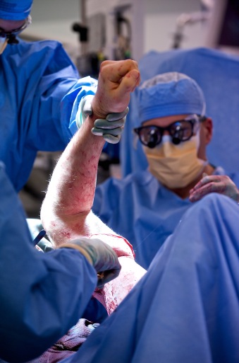 Physicians surgically connect the donor arm during the transplant operation. (Photo: Lightchaser Photography, courtesy of Brigham and Women's Hospital)