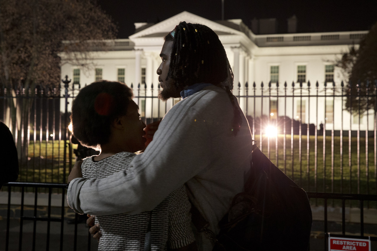 Bonnie Mills, 19, left, a junior at Howard University, is hugged by a friend, who asked not to be named, as they gather with students from Howard University and others in front of the White House. (Jacquelyn Martin/AP)