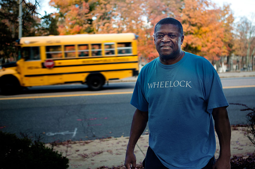 At this spot on Cummins Highway, Bobby Jenkins says white kids from Hyde Park would hide behind trees and throw rocks and bottles at the school bus Jenkins and other black students took after football practice on their way back to Mattapan. He still lives in Mattapan. (Jesse Costa/WBUR)