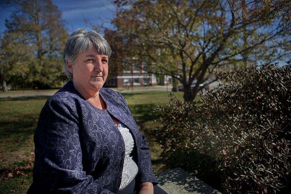 JoAnne Coon says she left the Boston school system because she had been beaten up. Her family moved to Walpole where she says she never felt at home. Now living in Plymouth, she wishes she could move back to Boston. (Jesse Costa/WBUR)