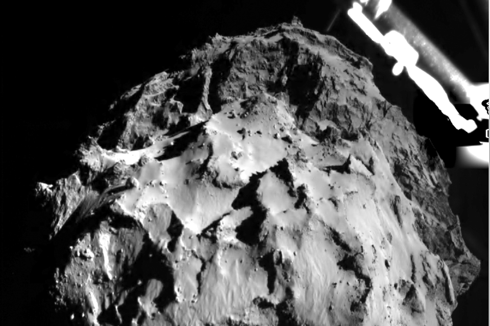 The picture released by the European Space Agency ESA on Wednesday, Nov. 12, 2014 was taken by the ROLIS instrument on Rosetta's Philae lander during descent from a distance of approximately 3 km from the 4-kilometer-wide (2.5-mile-wide) 67P/Churyumov-Gerasimenko comet. (AP)