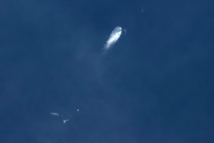 The Virgin Galactic SpaceShipTwo rocket explodes in the air during a test flight on Friday, Oct. 31, 2014. The explosion killed a pilot aboard and seriously injured another while scattering wreckage in Southern California's Mojave Desert, witnesses and officials said. (AP)