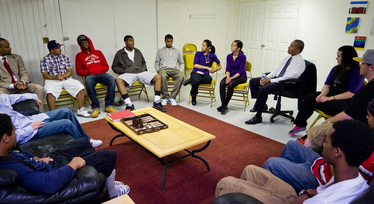 Pictured: Governor Deval Patrick meets with youth and community leaders at the Straight-Up Cafe in Worcester to discuss the impact of the Governor's Safe and Successful Youth Initiative (SSYI) in July, 2012. Patrick will convene a conference on prisoners' re-entry into society on December 18, 2014. (Eric Haynes/Governor's Office/Flickr)