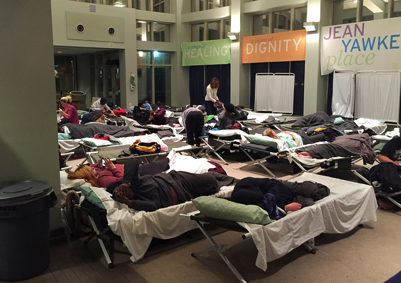 Dozens of homeless women have been sleeping in the atrium of the Boston Health Care for the Homeless respite facility since the bridge to Long Island was closed in October. (Lynn Jolicoeur/WBUR)