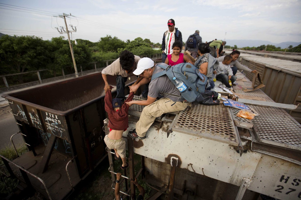 Central American migrants are atop the northbound "La Bestia" freight train in Ixtepec, Mexico, on July 12, 2014. (Eduardo Verdugo/AP)