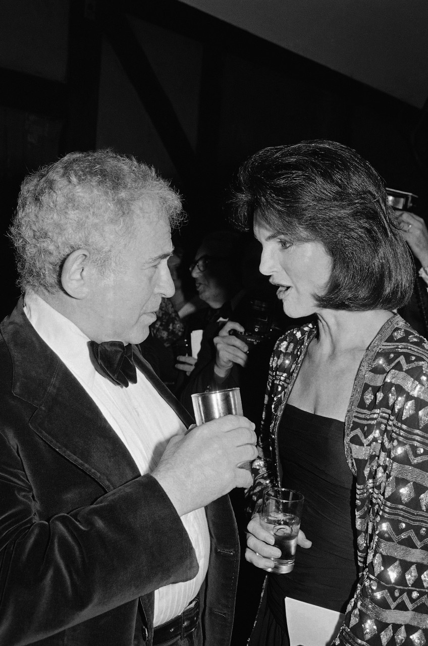 Norman Mailer chats with Jacqueline Onassis in 1978 at a publisher's party for the late Author James Jones (Richard Drew/AP)