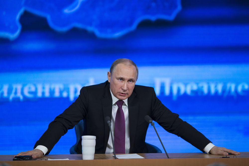 Russian President Vladimir Putin speaks during his annual news conference in Moscow, Russia, Thursday, Dec. 18, 2014. The Russian economy will rebound and the ruble will stabilize, Russian President Vladimir Putin said. (AP)