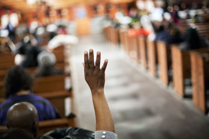 black people praying together