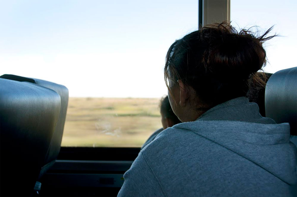 Lisette and Abigail on their bus ride from Carlsbad, N.M., to Boston (Shannon Dooling/WBUR)