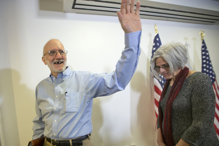 Alan Gross, waves as he and his wife Judy leave following his statement at his lawyer's office in Washington, Wednesday, Dec. 17, 2014. Gross was released from Cuba after 5 years in a Cuban prison. (AP)