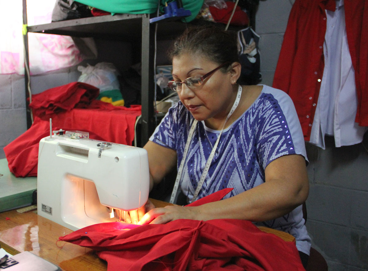 The biggest problem in this community next to poverty is police abuse,” says Maria Luz Panameno, a seamstress, labor organizer and leader in her local community of La Selva in Ilopango. (Shannon Dooling/WBUR)