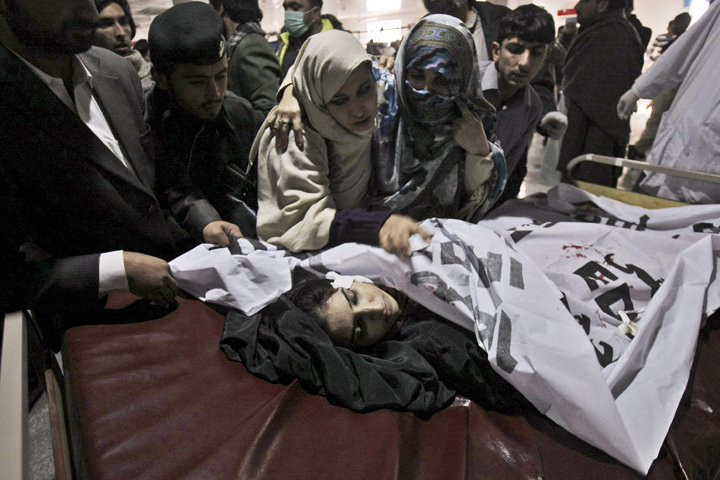 Relatives of a victim of a Taliban attack in a school, mourn over her lifeless body at a hospital in Peshawar, Pakistan, Tuesday, Dec. 16, 2014. Taliban gunmen stormed a military-run school in the northwestern Pakistani city of Peshawar on Tuesday, killing and wounding scores, officials said, in the highest-profile militant attack to hit the troubled region in months. (AP)