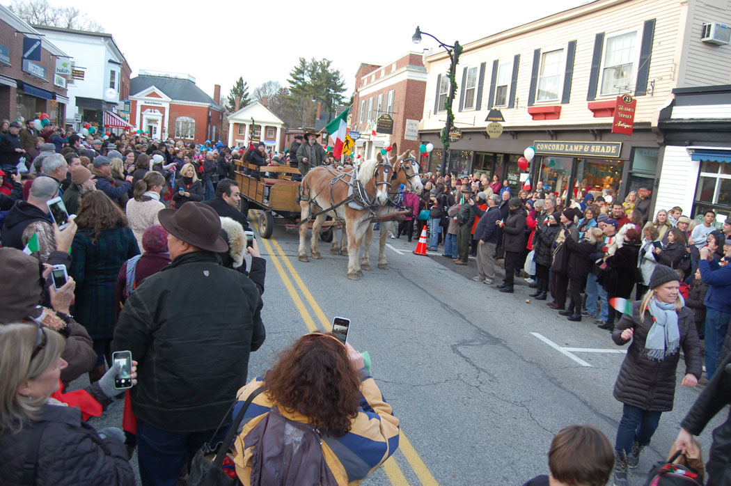 A horse-drawn wagon at the end of the parade carries the exalted crucolo cheese. (Greg Cook)