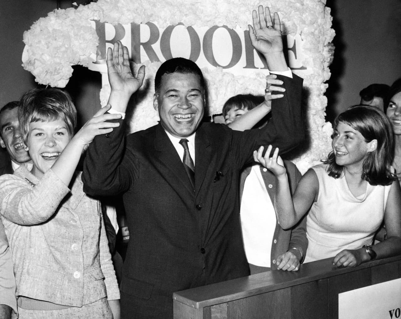 This Sept. 14, 1966, file photo shows Edward W. Brooke joining campaign workers in celebration, in Boston, after winning the Republican nomination for U.S. Senate. (AP)
