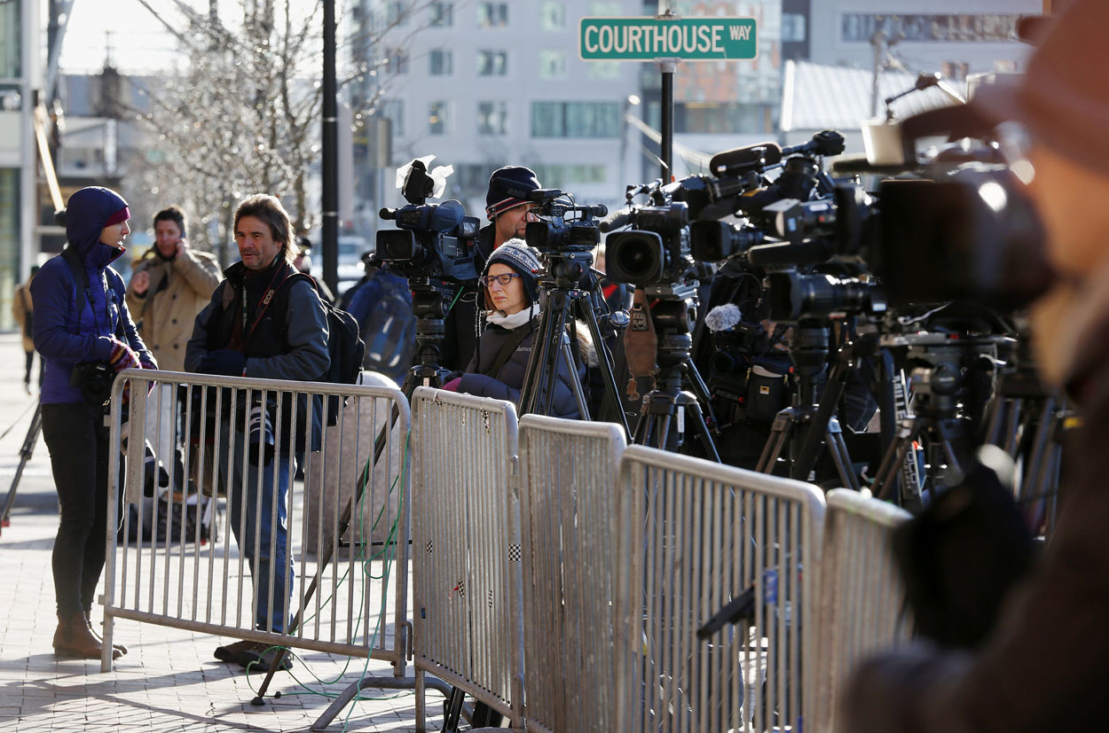 Media take positions outside the federal courthouse in Boston Monday for the first day of jury selection in the trial of Boston Marathon bombing suspect Dzhokhar Tsarnaev. (Michael Dwyer/AP)