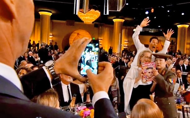 Benedict Cumberbatch photo bombed Meryl Streep and Margaret Cho at the 2015 Golden Globe Awards.