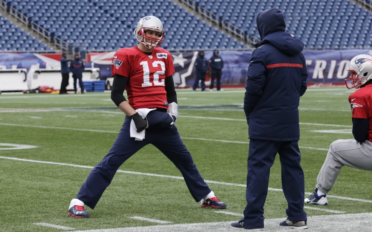 New England Patriots quarterback Tom Brady talks with offensive coordinator Josh McDaniels during a team practice in Foxborough, Mass. (Charles Krupa/AP)