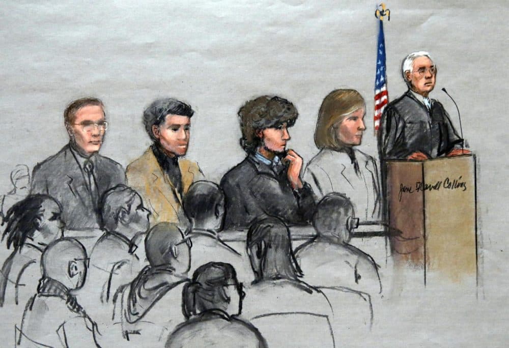 In this courtroom sketch, Boston Marathon bombing suspect Dzhokhar Tsarnaev, third from right, is depicted with his lawyers and U.S. District Judge George O'Toole Jr., right. (Jane Flavell Collins/AP)