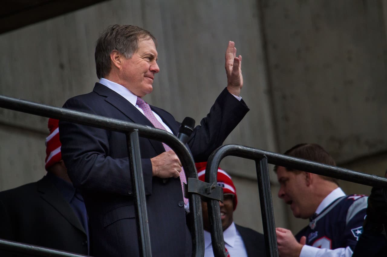 Patriots coach Bill Belichick waves to the crowd. (Jesse Costa/WBUR)