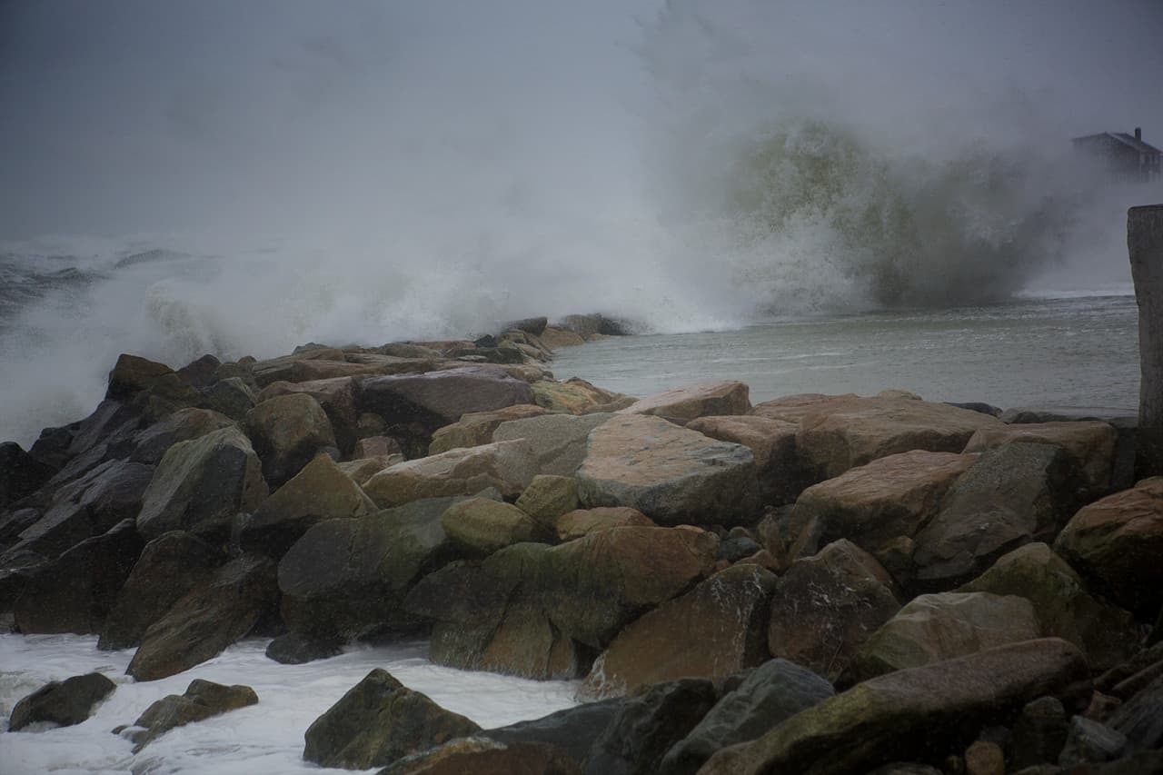 Waves crash in Minot. (Jesse Costa/WBUR)