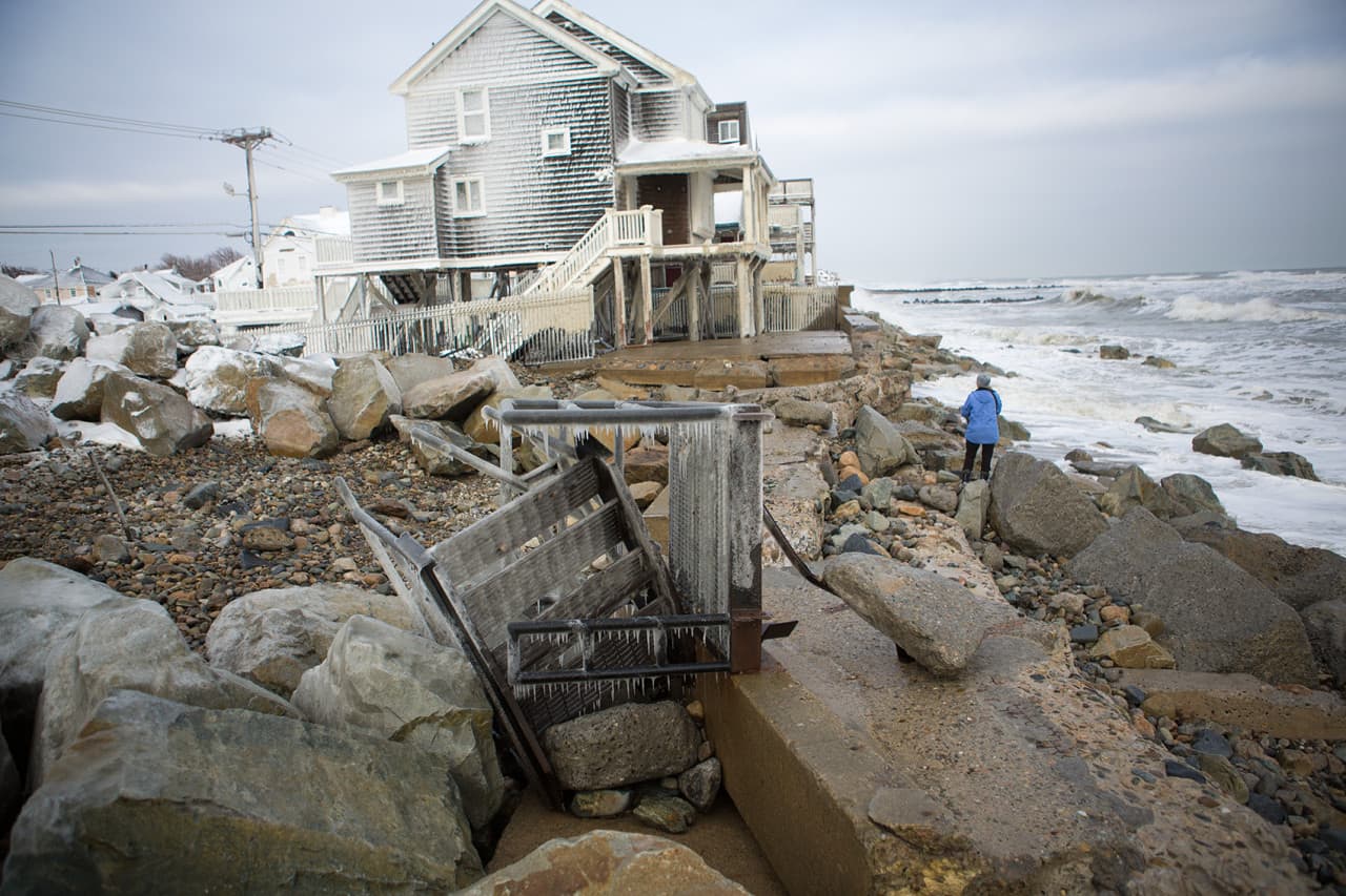 The seawall at Green Harbor in Marshfield was breached  and caused damage to houses. (Jesse Costa/WBUR)