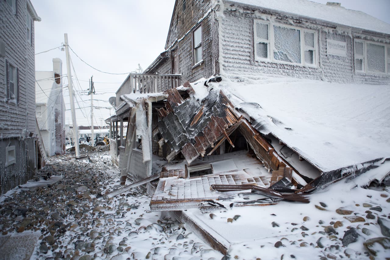 A house damaged in the Brant Rock area of Marshfield. (Jesse Costa/WBUR)