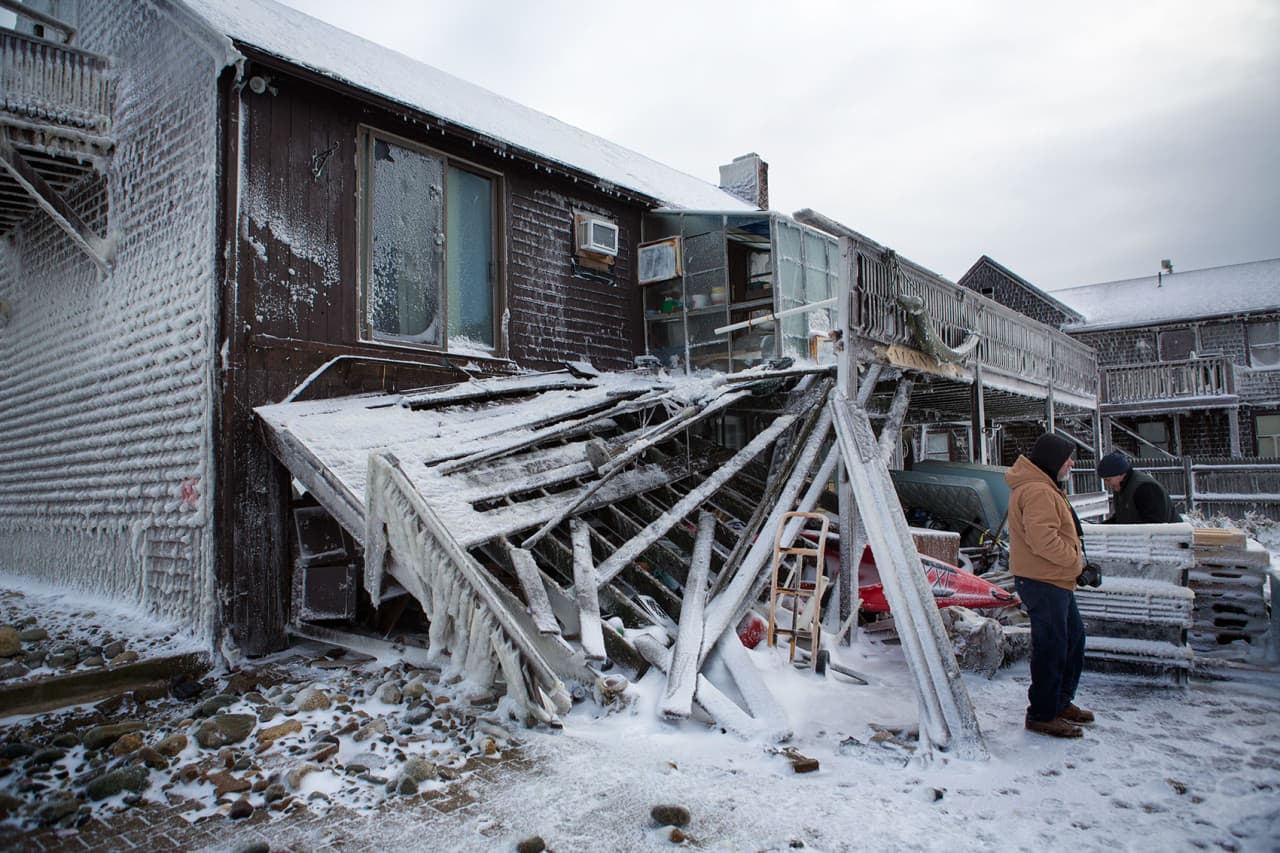 Many homes were damaged due to a breach in the seawall during the blizzard. (Jesse Costa/WBUR)