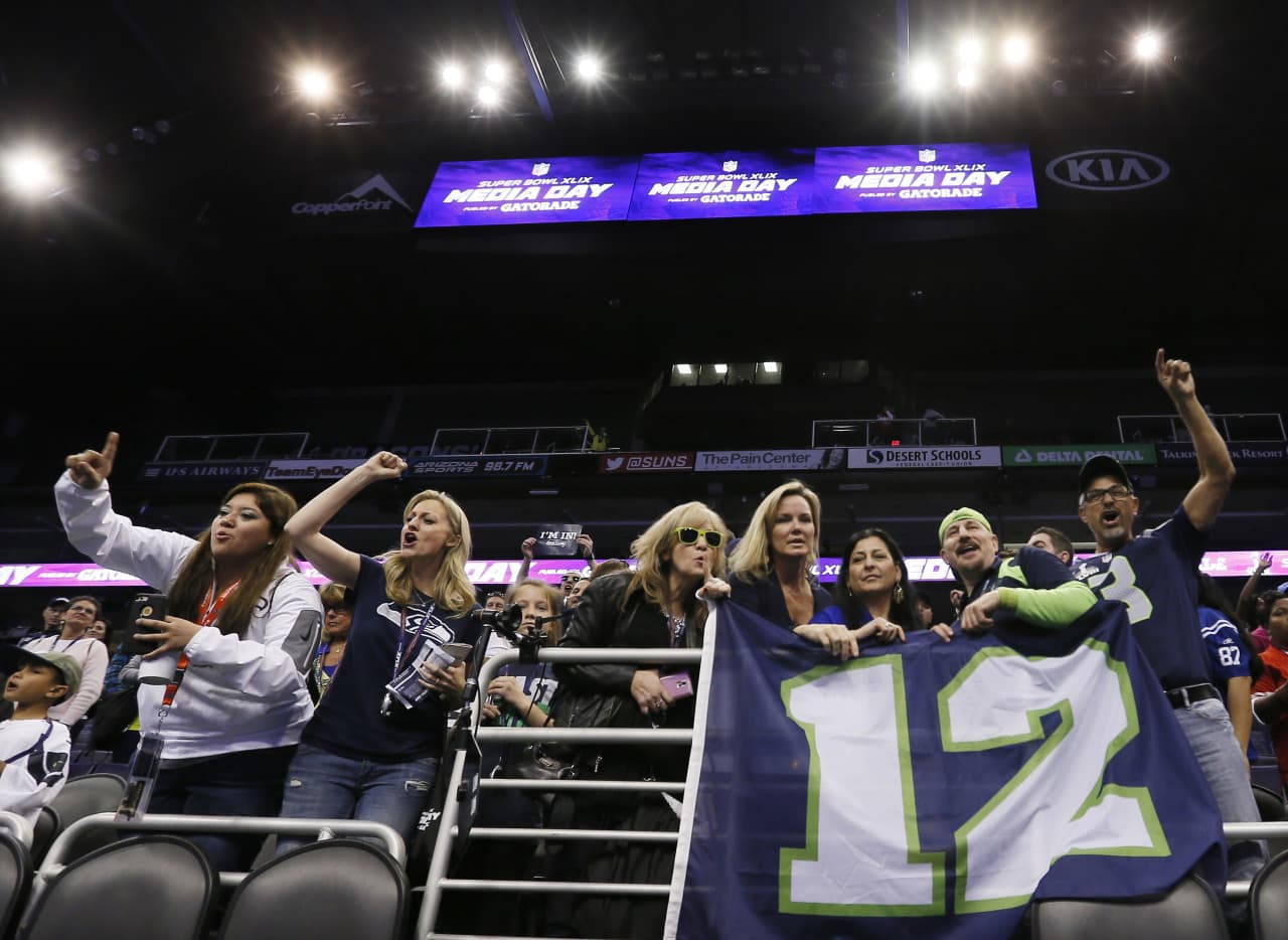 Seattle Seahawks fans cheer during media day for NFL Super Bowl XLIX football game Tuesday in Phoenix. (Matt York/AP)