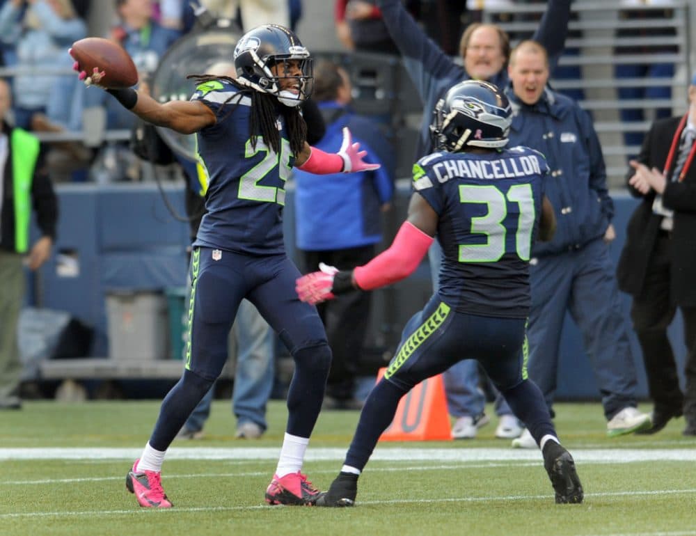 Richard Sherman (left) and Kam Chancellor (right) have helped anchor the Seahawks' secondary this postseason but even they get fined. (Steve Dykes/Getty Images)