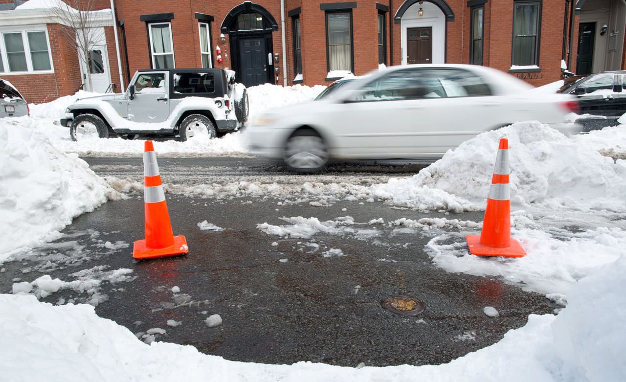 People in South Boston use random items to claim public parking spots after  winter storms 