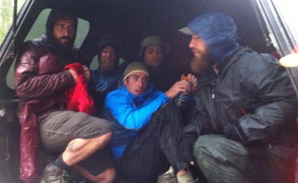 Hikers crowd into the back of a pickup truck to escape the rain. (Courtesy Brittany Goodson)