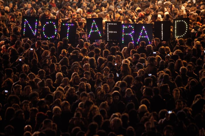 People gather in solidarity of the victims of a terror attack against a satirical newspaper, in Paris, Wednesday, Jan. 7, 2015. (AP)