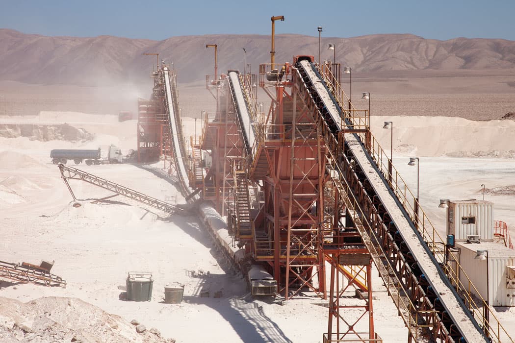 Conveyor belts at the mine carry chunks of salt through various crushing and sifting machines. (Allison Cekala)