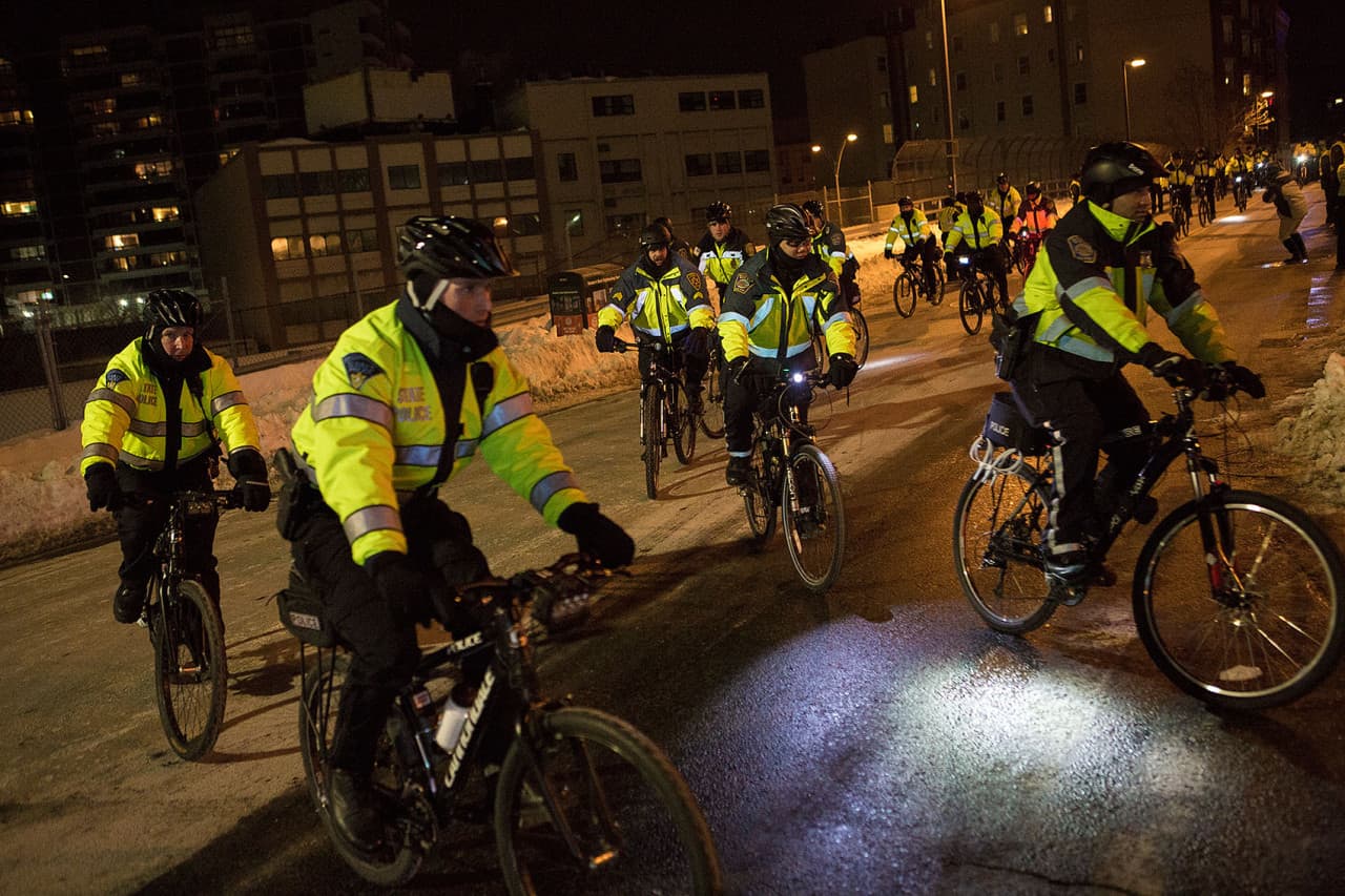 Boston Police on bicycles move onto Lansdowne Street. (Jesse Costa/WBUR)