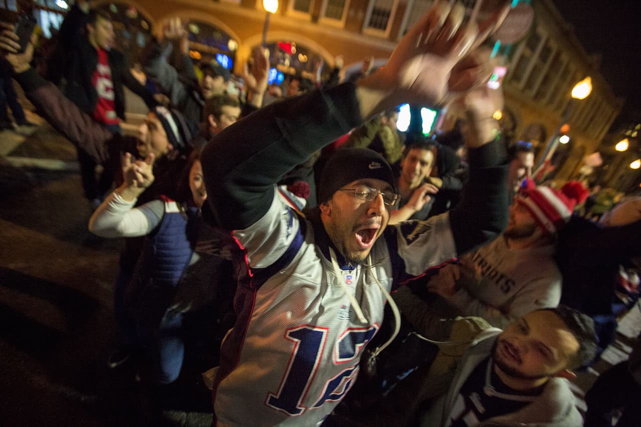 Fans celebrate the Patriots' dramatic Super Bowl win over the Seahawks in Kenmore Square. (Jesse Costa/WBUR)