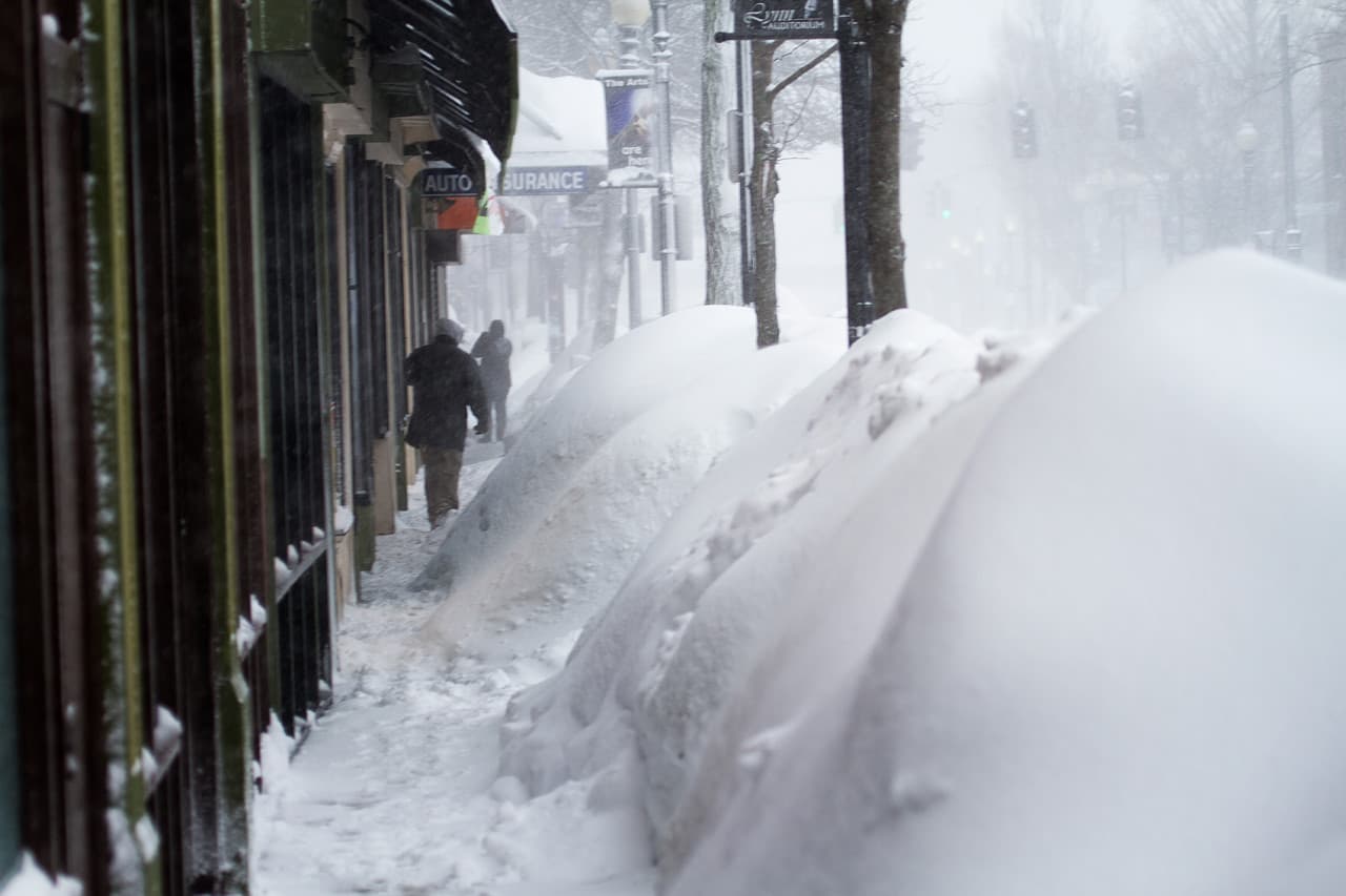 The snowbanks along Market Street in Lynn made sidewalks tough to navigate. (Jesse Costa/WBUR)