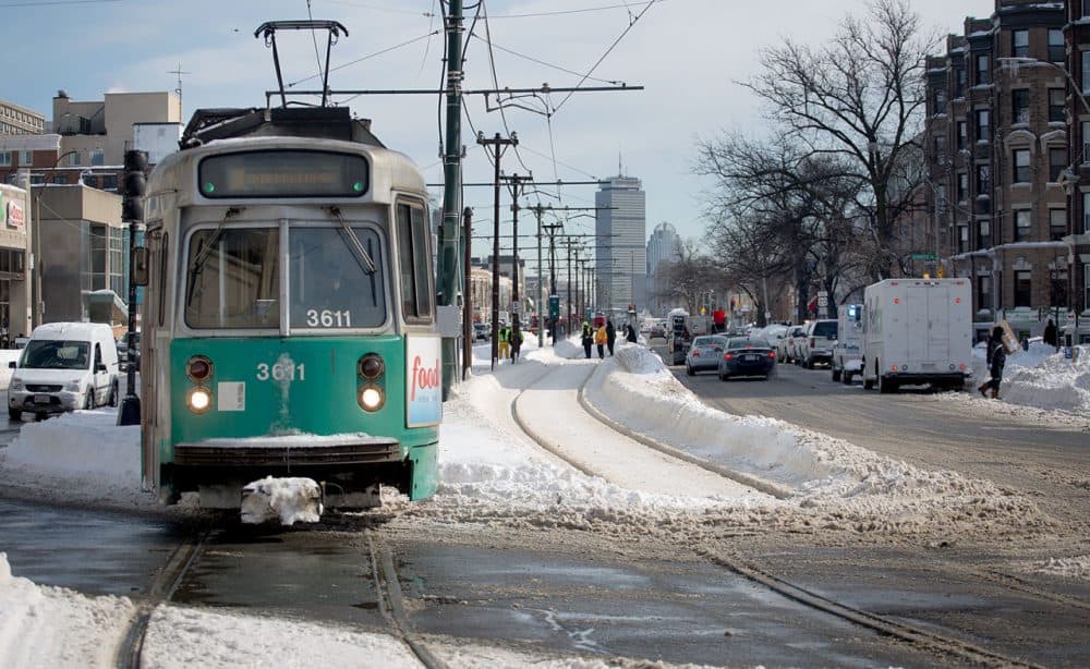 A Green Line trolley runs down Commonwealth Avenue in Boston this past winter. (Robin Lubbock/WBUR)