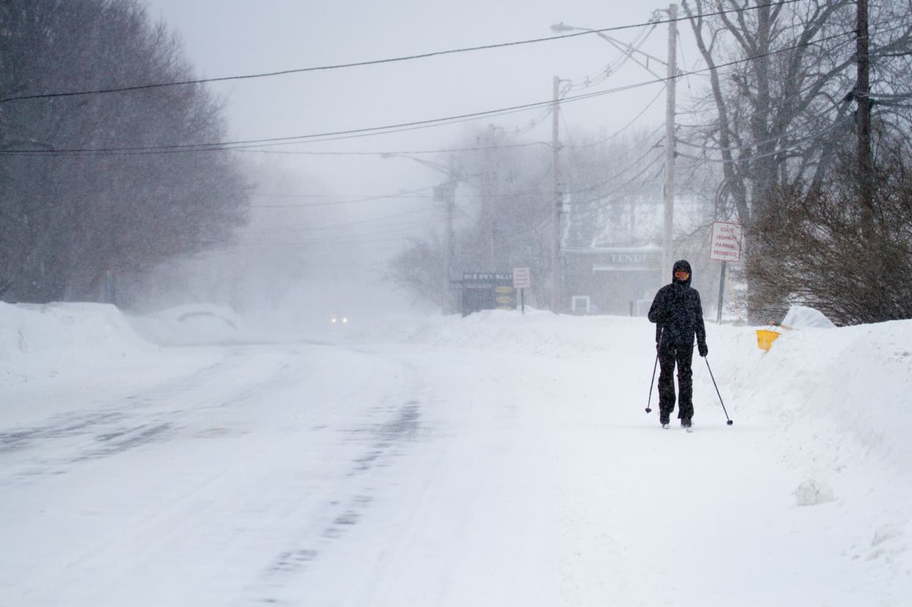 Stratton Lloyd cross-country skis on route 1A in Newbury Monday. (Jesse Costa/WBUR)