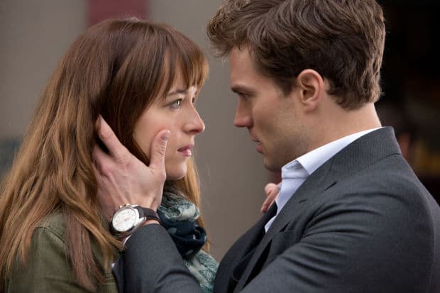 Dakota Johnson, left, and Jamie Dornan appear in a scene from "Fifty Shades of Grey." (Universal Pictures and Focus Features/AP)