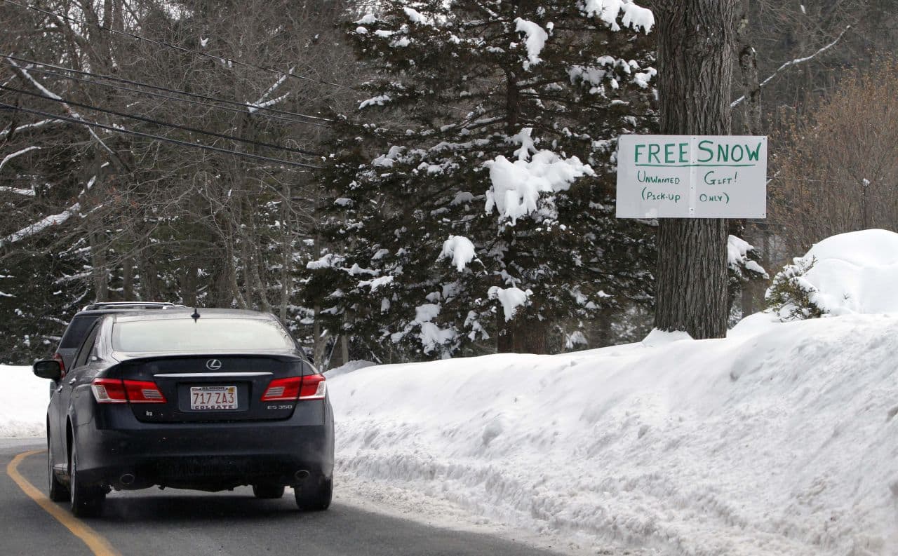 A sign in a Weston resident's front yard offers free snow on Wednesday. Another storm is forecast to bring more snow to the state this weekend. (Bill Sikes/AP)