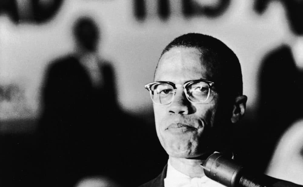 American civil rights activist Malcolm X (1925 - 1965) speaks at a podium during a Black Muslim rally in Washington DC, circa 1963. (Hulton Archive/Getty Images)