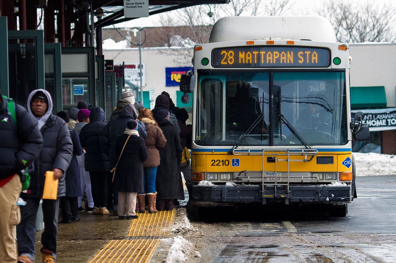 Commuters board the #28 Mattapan Station bus at Dudley Square MBTA station. (Jesse Costa/WBUR)