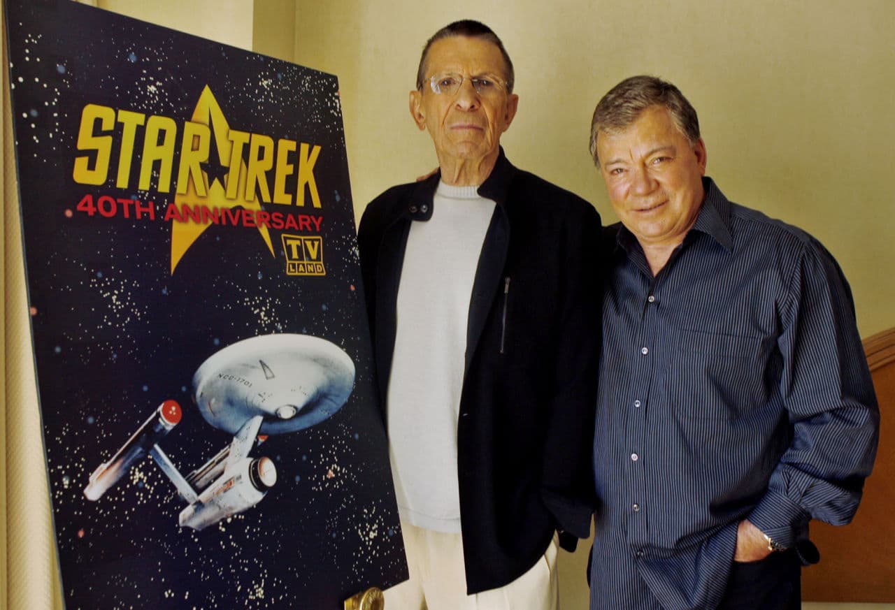Leonard Nimoy, left, and William Shatner pose before a poster advertising TV Land's celebration of the 40th anniversary of "Star Trek," which premiered in 1966. (Ric Francis/AP)