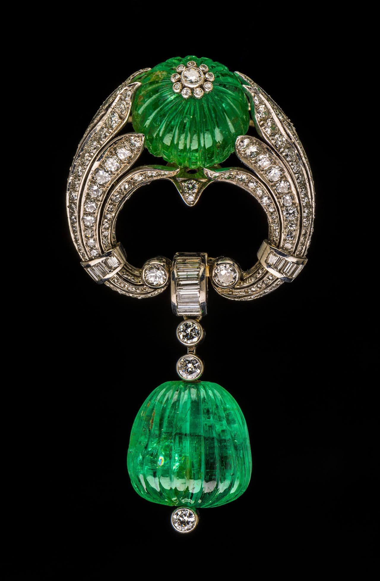 Art Deco platinum, carved emerald and diamond brooch about 1937 platinum, white gold, emeralds and diamonds. Gift of the heirs of Bettina Looram de Rothschild. (Courtesy Museum of Fine Arts, Boston)